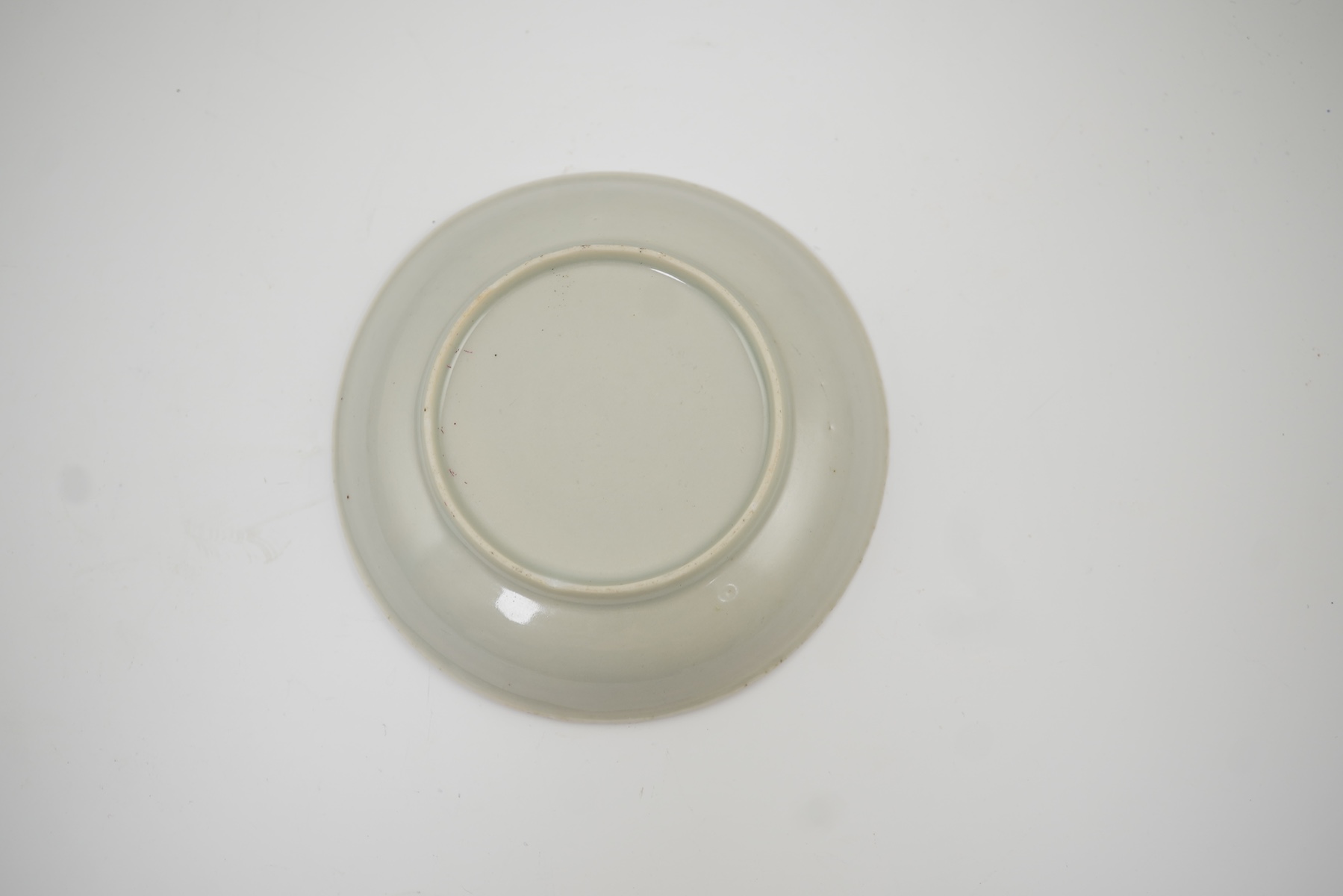 A Chinese semi-eggshell porcelain saucer and a similar tea bowl, Yongzheng period